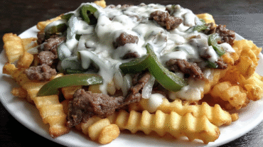 Philly Steak Cheese Fries with crispy fries, steak, and cheese